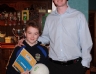 Benny Hasson presents Andrew Hasson with a football for third place Under 12 skills 
